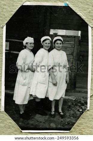 Ussr - CIRCA 1945: An antique Black & White photo show three nurses