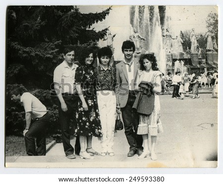 Ussr - CIRCA 1980s: An antique Black & White photo show a group of tourists on a background of Fantan