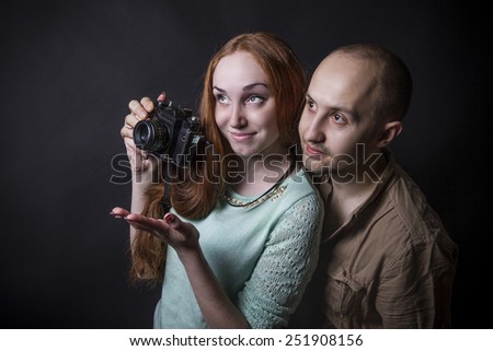 boy and girl on a retro shoot camera