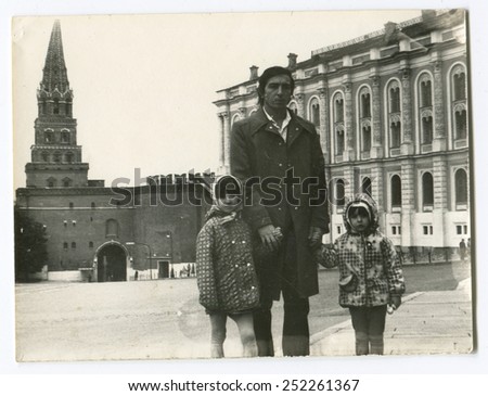 Ussr - CIRCA 1980s: An antique Black & White photo show father and two children