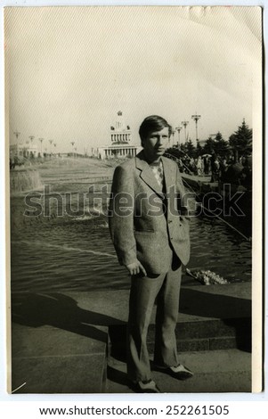 Ussr - CIRCA 1960s: An antique Black & White photo show man in a jacket on the river bank