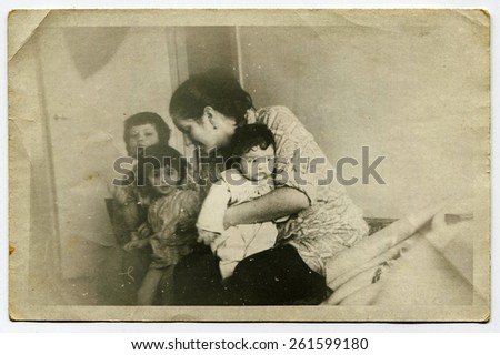 Ussr - CIRCA 1970s: An antique Black & White photo show mother with three children