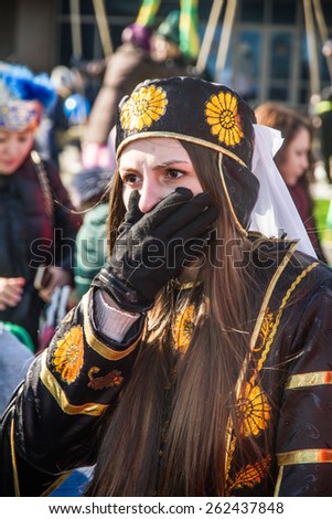 PETROPAVLOVSK, KAZAKHSTAN - MARCH 21, 2015: celebration of the new year on the solar calendar astronomical in Iranian and Turkic peoples. The girl in national dress