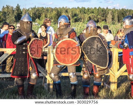 OMSK, RUSSIA - AUGUST 1, 2015: Unidentified participants in medieval fight at a historical reenactment festival 