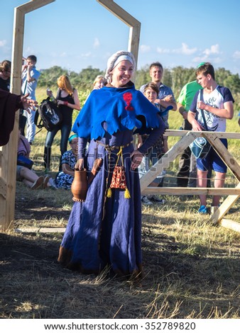 OMSK, RUSSIA - AUGUST 2, 2015: Girl in medieval period costumes. a historical reenactment festival \
