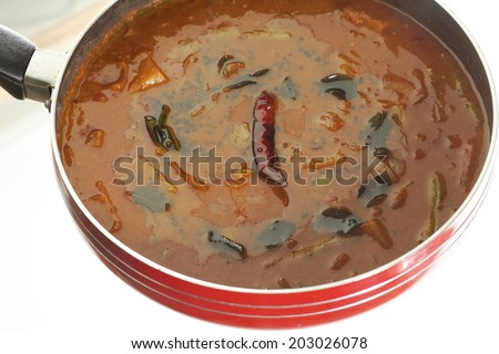 Sambar - Spicy Lentils from South India-Top view of Sambar from south India. Sambar is made of tuvar dal cooked with vegetables, tamarind water and fresh Indian spices.