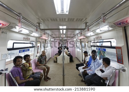 MUMBAI, INDIA - August 29th 2014:Mumbai Monorail train running and commuters sitting & standing in the mono. Comfortable, modern , fast, new & air conditioned way of transport in Mumbai India.