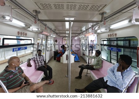MUMBAI, INDIA - August 29th 2014:Mumbai Monorail train running and commuters sitting & standing in the mono. Comfortable, modern , fast, new & air conditioned way of transport in Mumbai India.