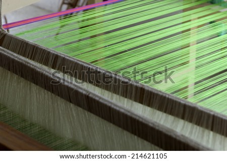 weaving of silk threads with gold thread a speciality of town Paithan in Maharashtra,India, so known as Paithani Saree.