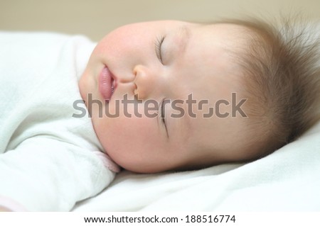 Newborn white caucasian baby sleeping
