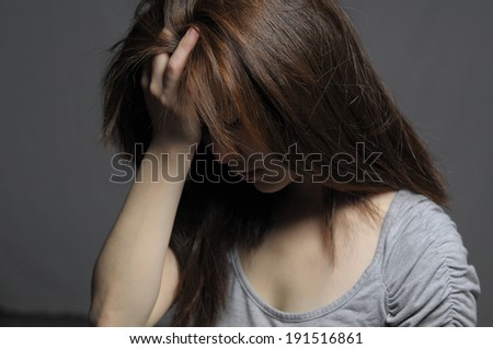Depressed woman in despair facial close up