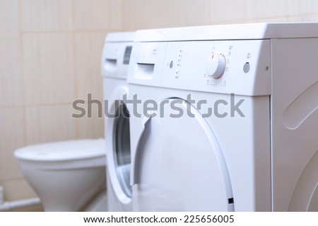 drying machine, laundry washer  and lavatory bowl in the bathroom, white and clean