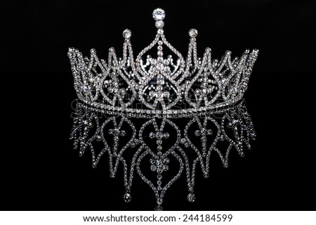 Beauty or Miss contest crown isolated on black with reflection.