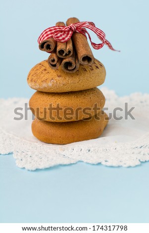 gingerbread honey cookies and cinnamon sticks  on blue vintage background/ gingerbread cookies and cinnamon