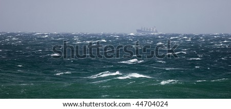 Cargo ship in storming sea