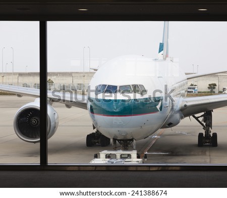 Osaka, Japan - Nov 7: A Cathay Pacific passenger airplane in the Kansai International Airport in Osaka, Japan on Nov 7, 2014. Cathay Pacific is an international airline based in Hong Kong.