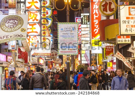 Osaka, Japan - Oct 28: Tourists visiting Dotonbori in Osaka, Japan at night on Oct 28, 2014.  Dotonbori is one of the principal tourist destinations in Osaka, Japan.