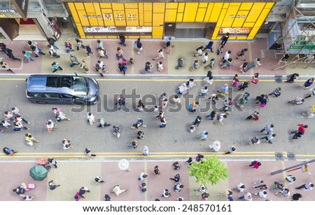 Hong Kong, China - October 19, 2013: Pedestrians walking on a street in Causeway Bay, Hong Kong. Causeway Bay is a major shopping district, and one of the most crowded area in Hong Kong