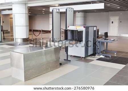 X-ray scanner and metal detector at airport security checkpoint