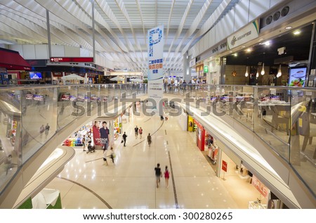 Hong Kong, China - Jun 23, 2015: People visiting a shopping mall in the Hong Kong Internaional Airport