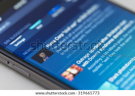 Melbourne, Australia - Sep 22, 2015: Snippets of news on one of the home screens of an iPhone 6 running iOS 9. This is one of the new features of iOS 9.