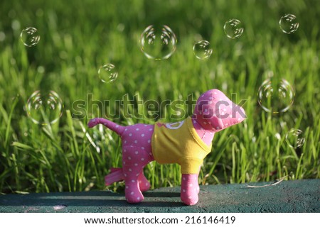 http://www.shutterstock.com/pic-216146419/stock-photo-toy-dog-grass-bright-summer-sun.html?src=mW1neXwEkG9s-AX5tNhp9A-1-99