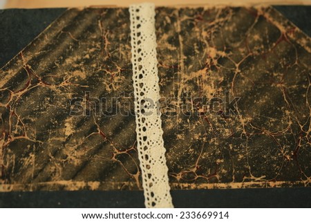 abstract vintage background is blurred old books lace tree selective soft focus toned photo