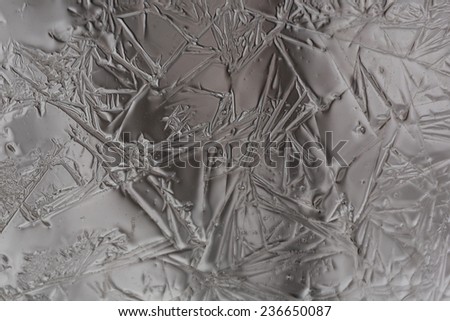 frost on the glass window abstract background is selective soft focus toned photo winter christmas