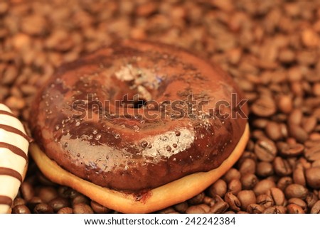 chocolate donuts coffee beans sweet dessert selective soft focus toned photo