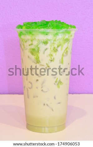 Iced sweet milk tea with cream soda flavor in plastic cup