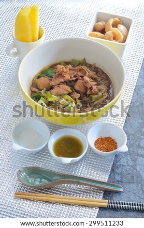 fine cut white rice noodle thicken soup with sliced pork and pork ball