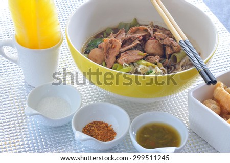 fine cut white rice noodle thicken soup with sliced pork and pork ball