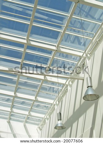 Glass roof and suspended lamps