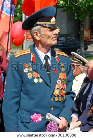 KIEV, UKRAINE - MAY 9: A war veteran at ceremonial parade at Kiev main street - Khreshchatyc - dedicated to the 64th Anniversary of victory in Great Patriotic War (World War II). More in MY GALLERY