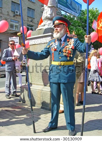 KIEV, UKRAINE - MAY 9: A war veteran at ceremonial parade at Kiev main street - Khreshchatyc - dedicated to the 64th Anniversary of victory in Great Patriotic War (World War II) May 9, 2009 in Kiev.