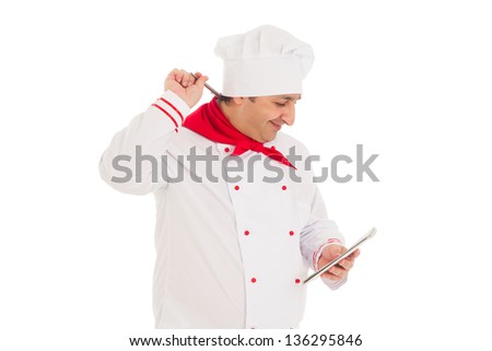 smiling cook man holding notebook and pen, thinking,  wearing red and white uniform in the studio over white background