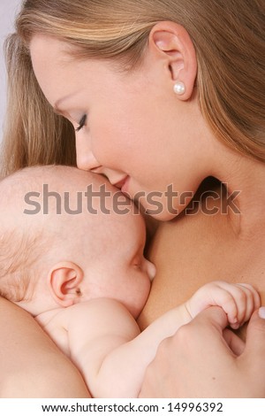 mother kissing her child