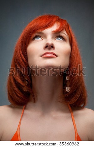 stock photo beautiful redhead girl looking up