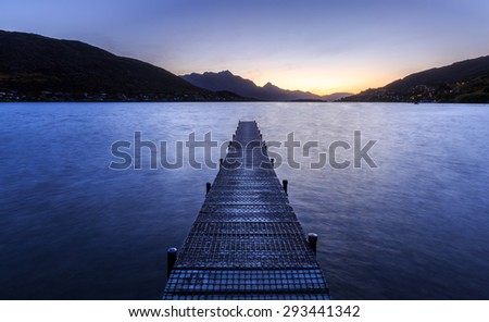 wooden pier on big lake in Queenstown, New Zealand