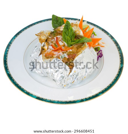 thai steamed fish curry custard in Tin foil (Hormok) isolated on white background