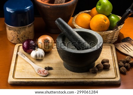 Fine art still life with mortar and pestle on Cutting Board