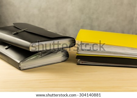Stack of file folders on wood table