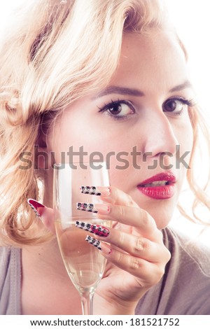 Beauty girl with sensual red lips long nails and glass of champagne isolated on white background