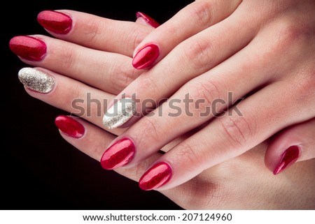 Red Silver Painted nails and hands isolated on black background