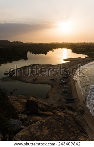 Boats, surfers and sunset seen from the elephant rock in Sri Lanka
