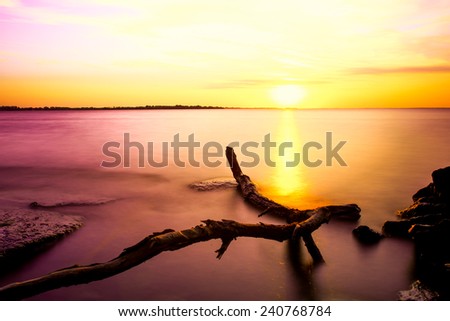 Long exposure of a sunset to get smooth water.