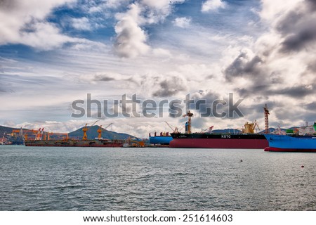 Geoje, South Korea - 11 February 2014:  Vessel\'s from oil tankers to cargo ships sit in the ship building yard at DSME.