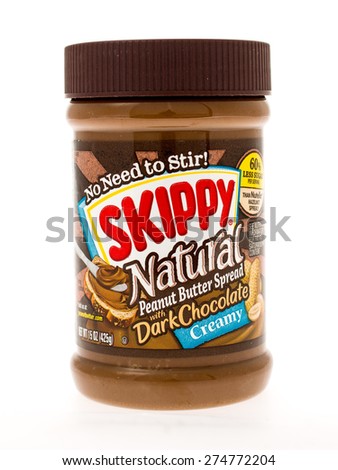 Winneconne, WI - 3 May 2015:  Jar of Skippy Natural peanut butter with dark chocolate in creamy style.