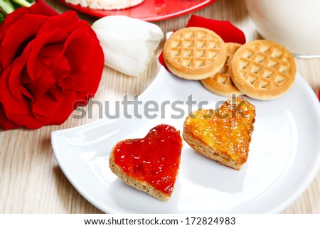 a sweet breakfast with love and red hearths of jam