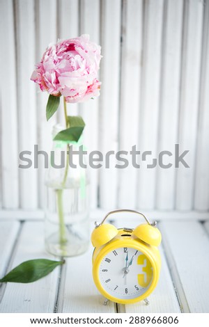morning alarm clock with flowers, peonies